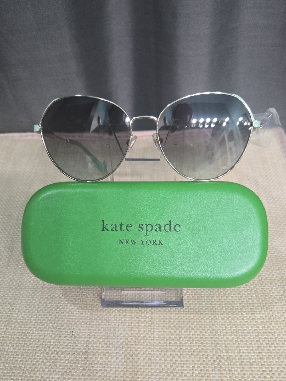 kate spade Silver Frame Sunglasses with Green Temple Accents